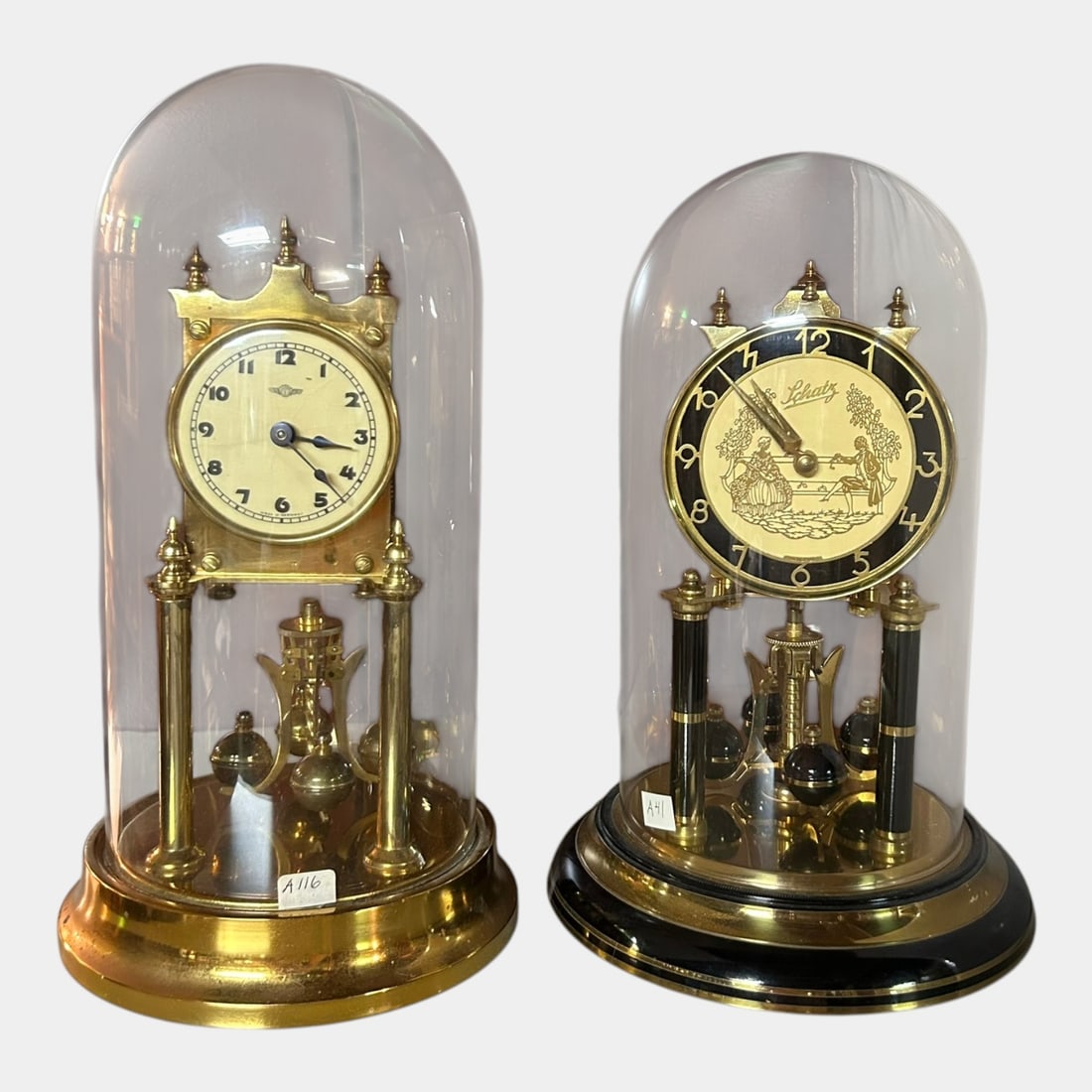 Kienzle & Schatz German Mid Century Brass Glass Dome Torsion Anniversary Clocks: Professional, fast, and affordable in house shipping available for all items. For higher resolution images please visit bid.craftedauctions.com Kienzle & Schatz German Mid Century Brass Glass Dome Tor