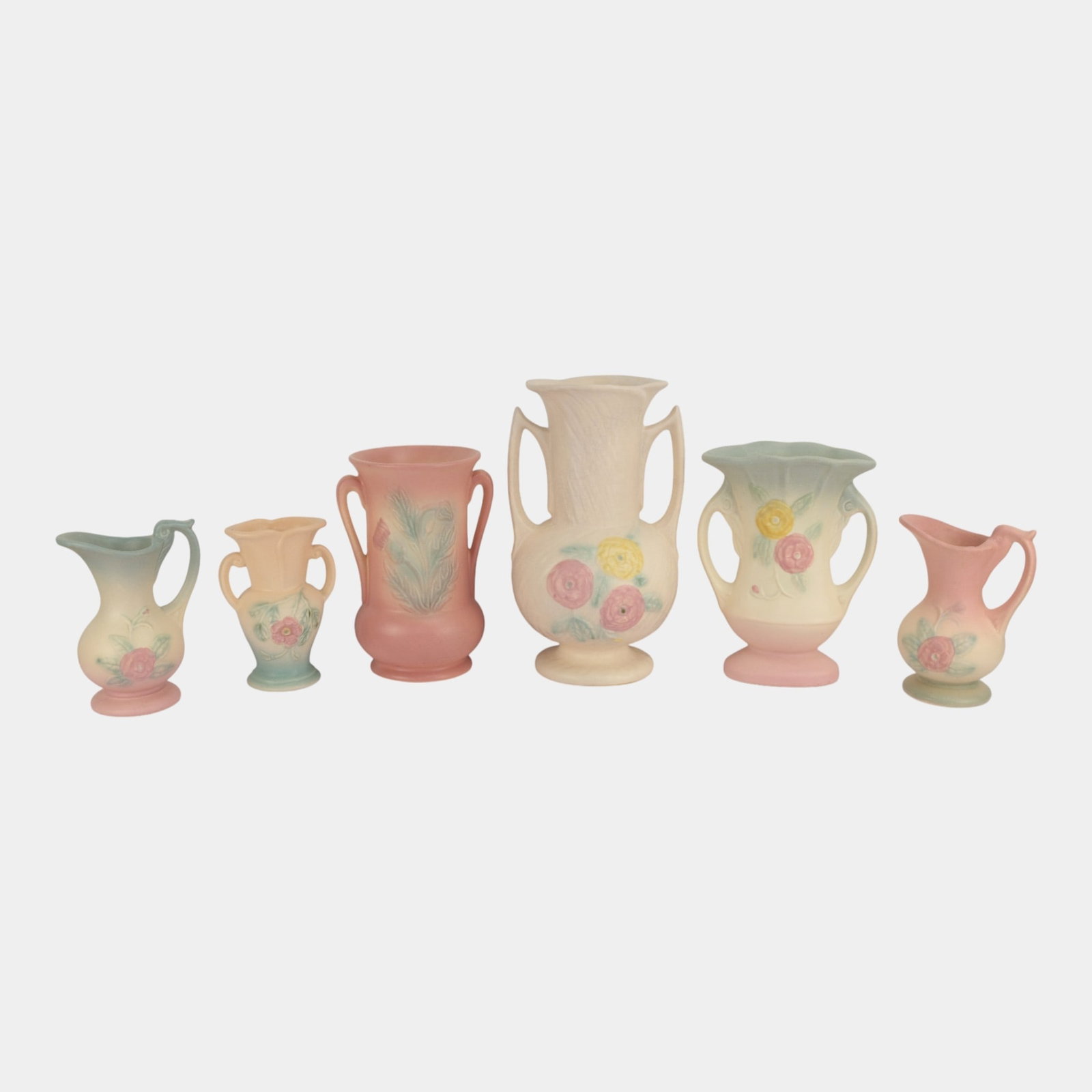 Hull Art Pottery Assorted Pink Blue Handled Vases And Pitchers: Professional, fast, and affordable in house shipping available for all items. For higher resolution images please visit bid.craftedauctions.com Hull Art Pottery Assorted Pink Blue Handled Vases And Pi