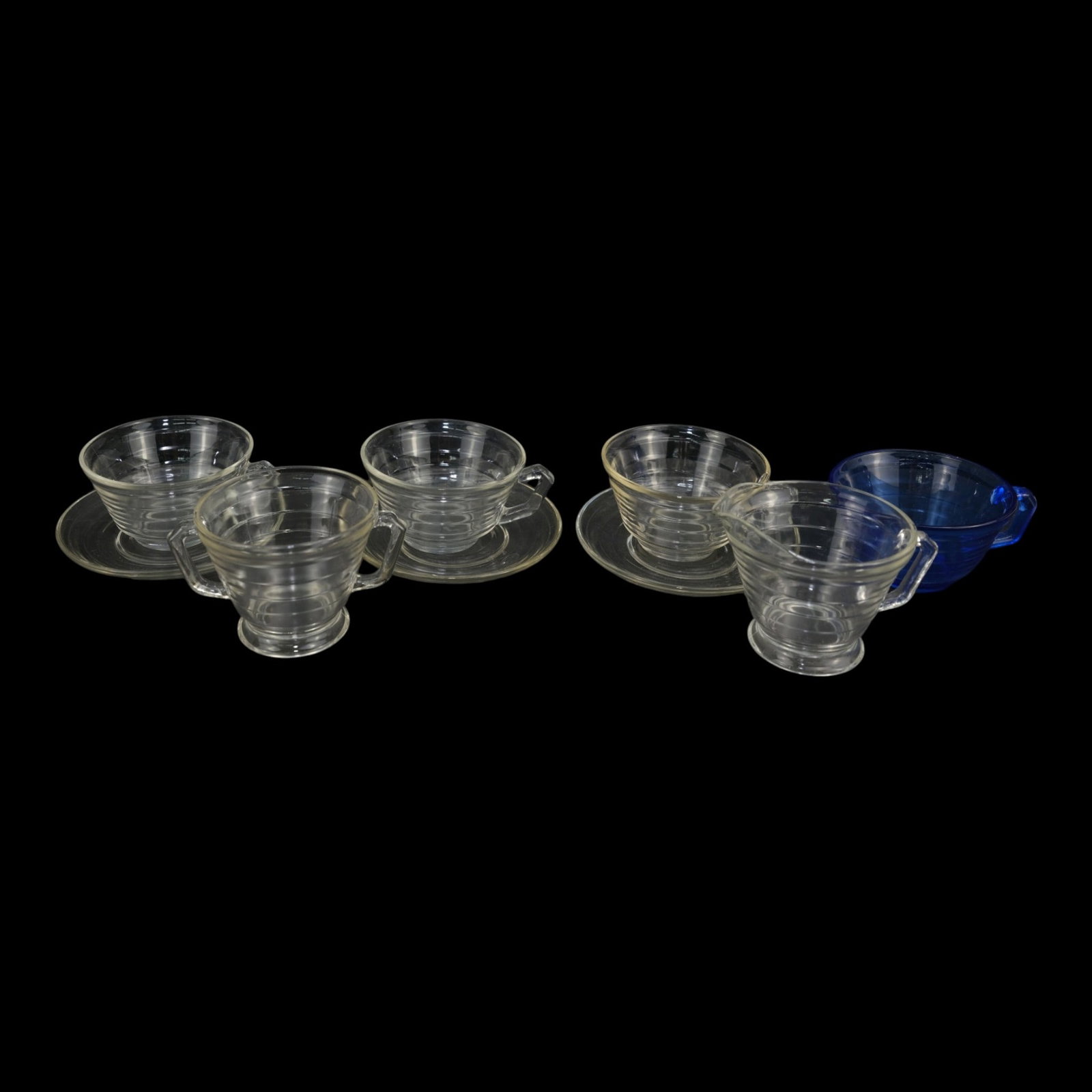 Mid Century Modern Clear Blue Ribbed Glass Cups Saucers & Creamer And Sugar Bowl: Professional, fast, and affordable in house shipping available for all items. For higher resolution images please visit bid.craftedauctions.com Mid Century Modern Clear Blue Ribbed Glass Cups Saucers 