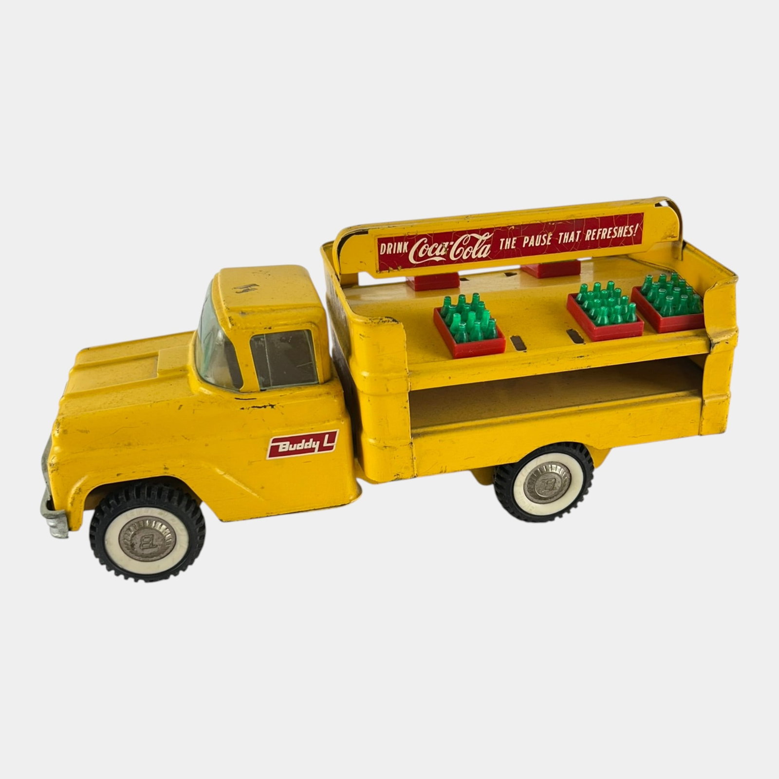 Buddy L 1950s Pressed Steel Yellow GMC Coca Cola Delivery Truck Toy Car: Professional, fast, and affordable in house shipping available for all items. For higher resolution images please visit bid.craftedauctions.com Buddy L 1950s Pressed Steel Yellow GMC Coca Cola Deliver