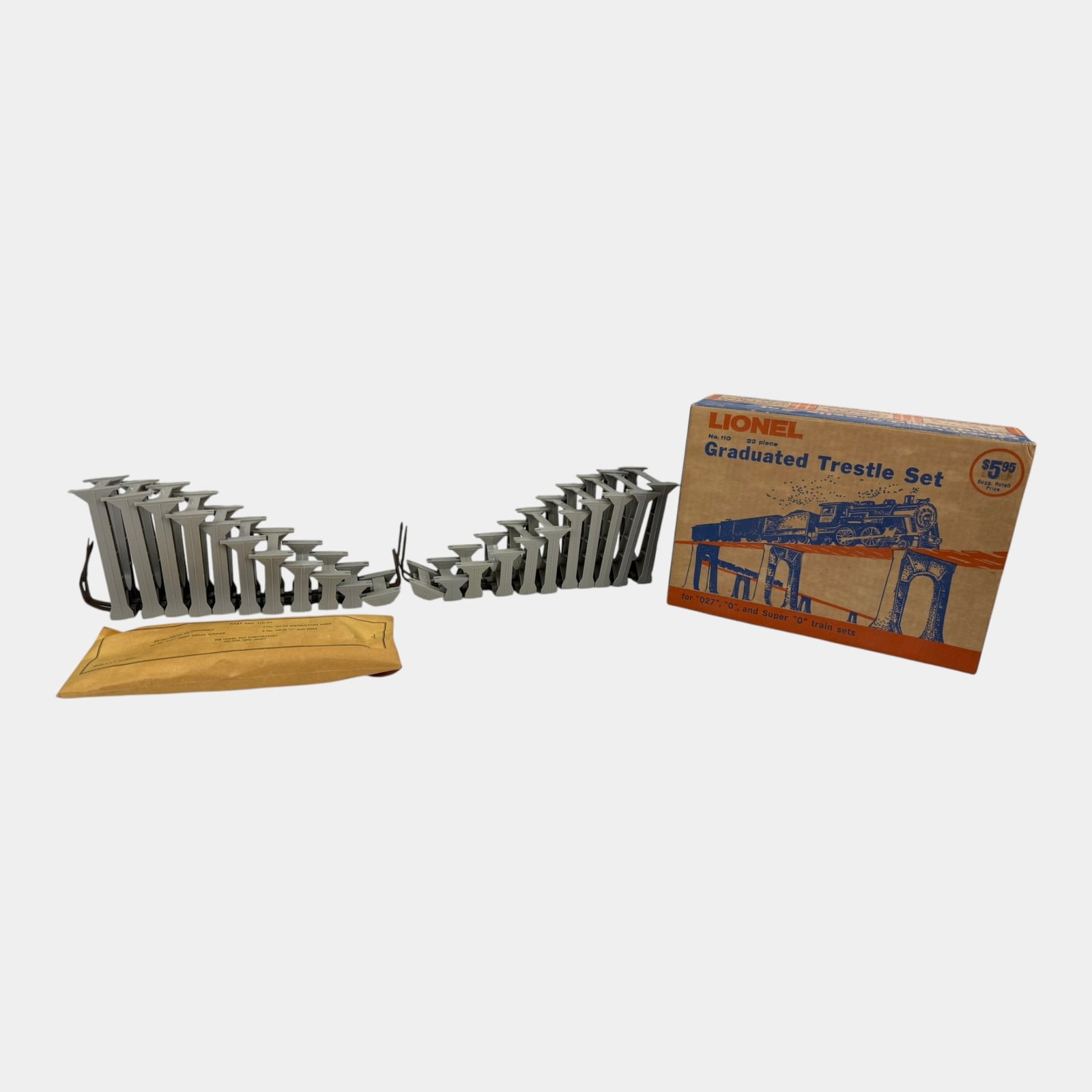 Lionel Trains Post War Gray Plastic Graduated Trestle Set With Original Box: Professional, fast, and affordable in house shipping available for all items. For higher resolution images please visit bid.craftedauctions.com Lionel Trains Post War Gray Plastic Graduated Trestle Se