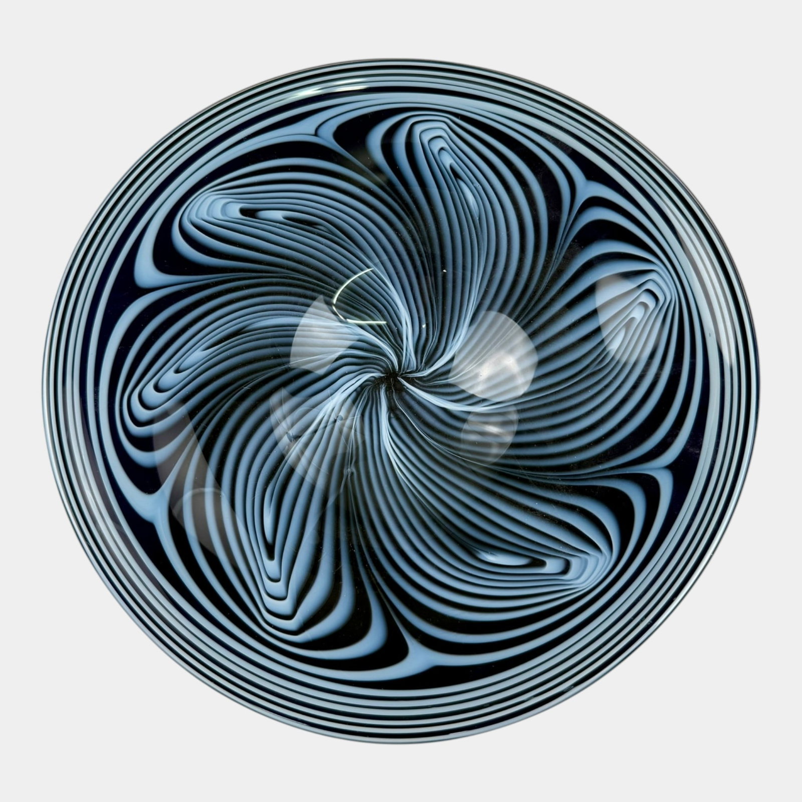 Contemporary Black Blue White Swirled Op Art Glass Shallow Center Bowl: Professional, fast, and affordable in house shipping available for all items. For higher resolution images please visit bid.craftedauctions.com Contemporary Black Blue White Swirled Op Art Glass Shall