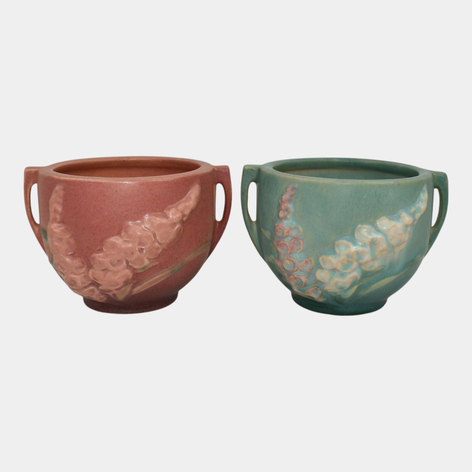 Roseville Foxglove Green Pink Jardiniere Planters: Professional, fast, and affordable in house shipping available for all items. For higher resolution images please visit bid.craftedauctions.com Roseville Foxglove Green Pink Jardiniere Planters Pair o