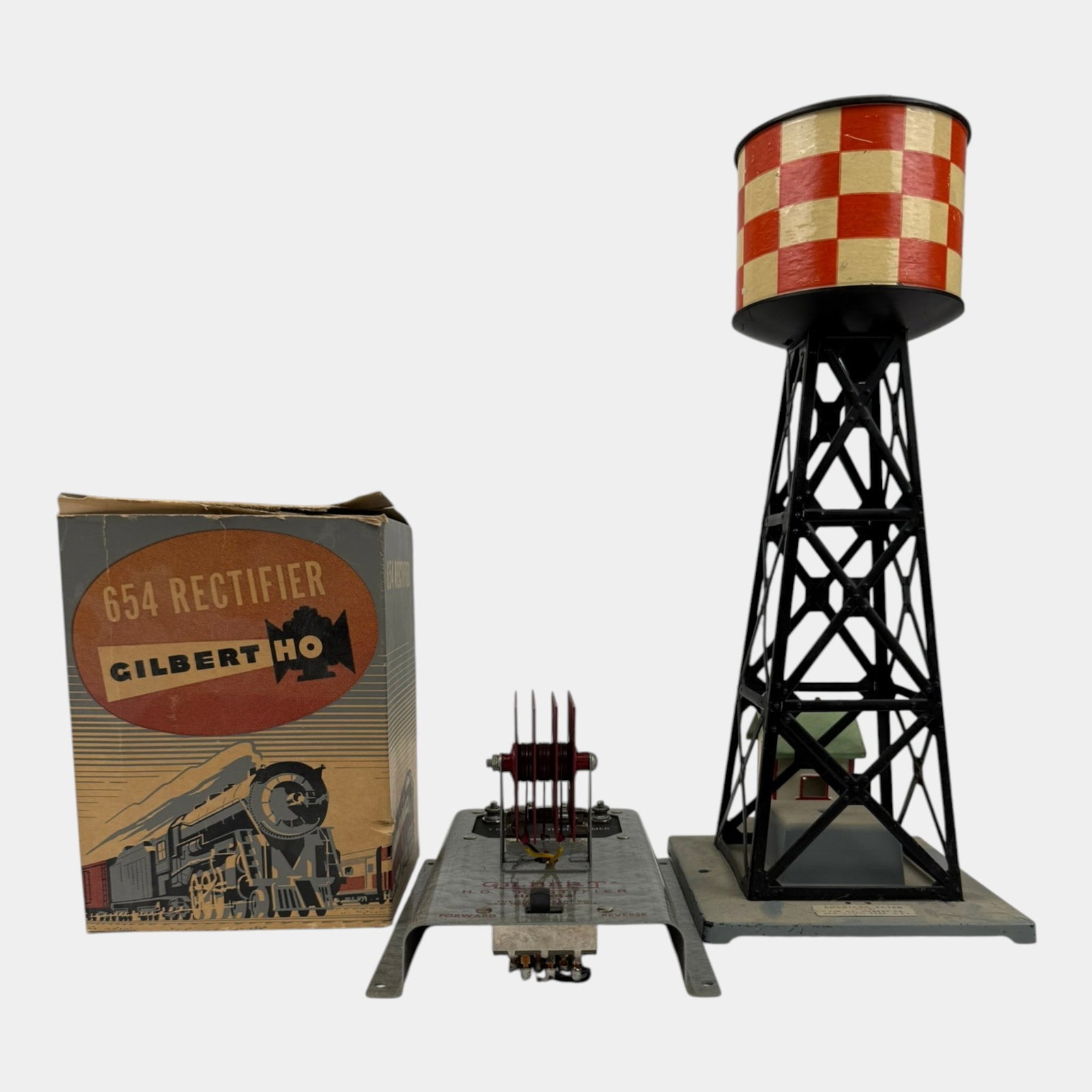 A.C. Gilbert American Flyer Lines Tin Plate Water Tower & 654 Rectifier With Original Box: Professional, fast, and affordable in house shipping available for all items. For higher resolution images please visit bid.craftedauctions.com A.C. Gilbert American Flyer Lines Tin Plate Water Tower 