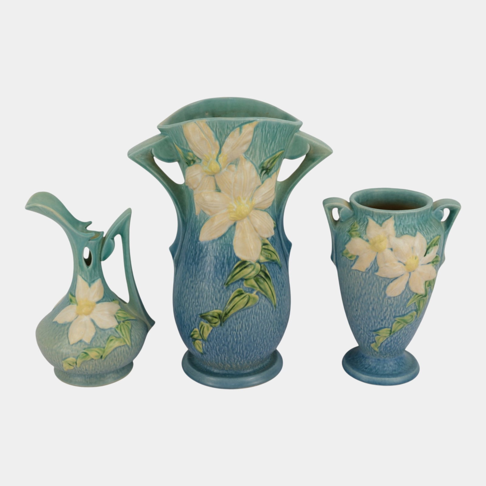 Roseville Clematis Blue 1944 Vintage Art Pottery Ceramic Handled Vases And Ewer: Professional, fast, and affordable in house shipping available for all items. For higher resolution images please visit bid.craftedauctions.com Roseville Clematis Blue 1944 Vintage Art Pottery Ceramic