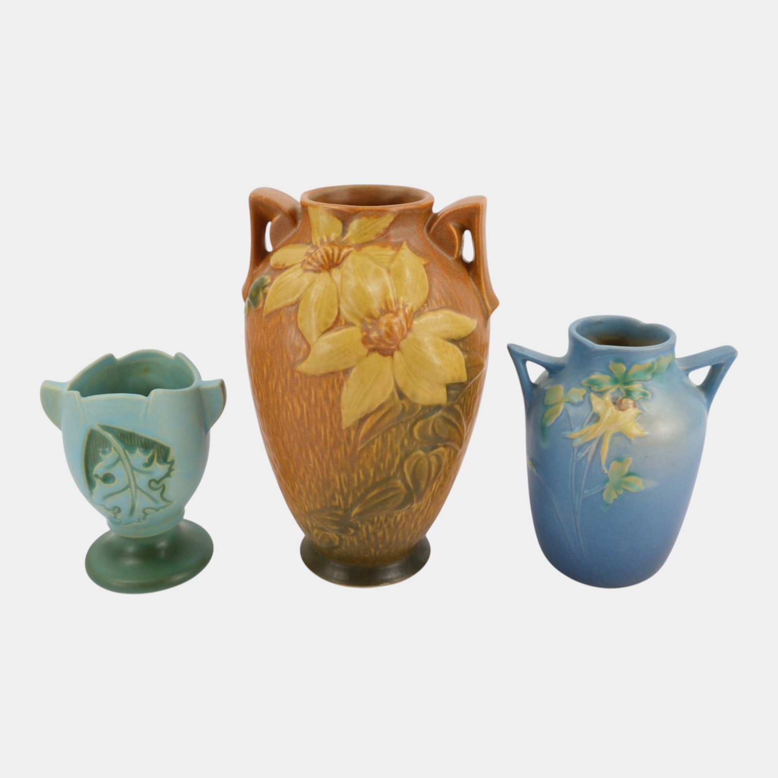 Roseville Clematis Columbine Silhouette Vintage Art Pottery Colorful Handled Ceramic Vases: Professional, fast, and affordable in house shipping available for all items. For higher resolution images please visit bid.craftedauctions.com Roseville Clematis Columbine Silhouette Vintage Art Pott