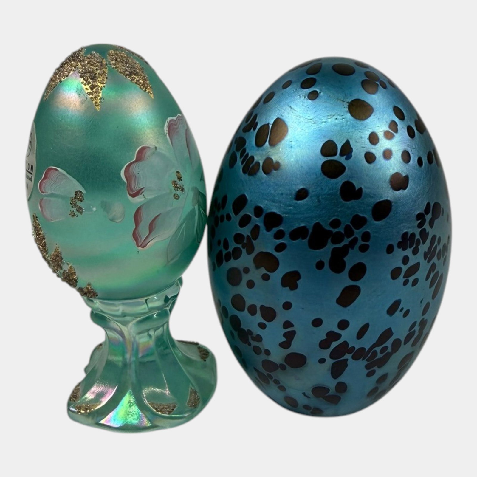 Fenton Floral Hand Painted Green Egg Paperweight & Robert Eickholt Blue Speckled Egg Paperweight: Professional, fast, and affordable in house shipping available for all items. For higher resolution images please visit bid.craftedauctions.com Fenton Floral Hand Painted Green Egg Paperweight & Rober