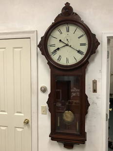 Ansonia General Regulator Wall Clock: Ansonia "General" Regulator Wall Clock. Cherry or walnut case, all original, still in running condition, weight driven, possibly hung in an early railroad station. Has the sweep second hand, has the