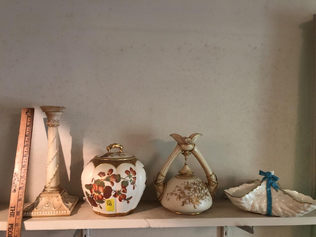 4 Pieces of Royal Worcester: 4 Pieces of fine Royal Worcester porcelain including; Double handled ewer, candle holder, bisquit jar, flower center or candy dish with unusual blue glass, and candle holder. These were lovingly cared