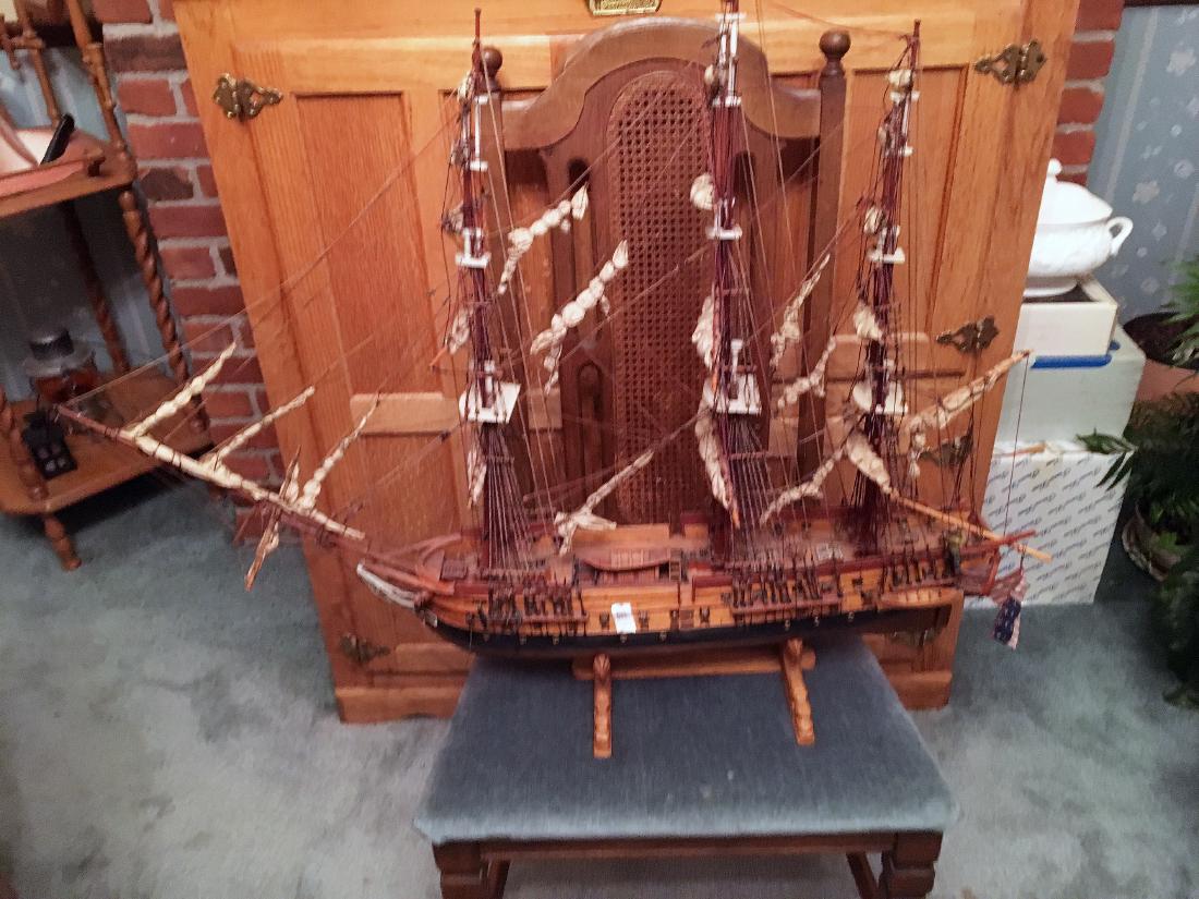 Model Ship: Model ship, measures approx. 37" long. Wood carved on stand. Masts, rolled sails, cannons.