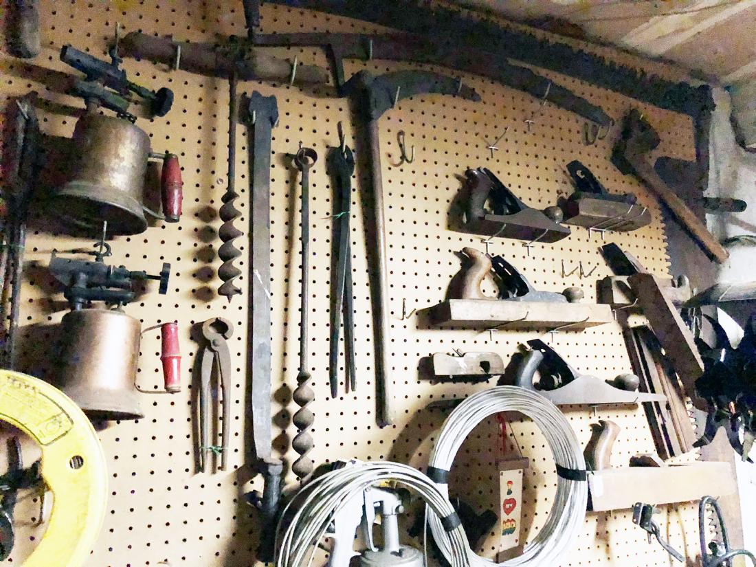 Vintage Tools: Vintage estate tools lot, being sold as found at the estate, includes 2 man saws, wooden planes, ice and hand augers, wooden pully, farm tools, etc.
