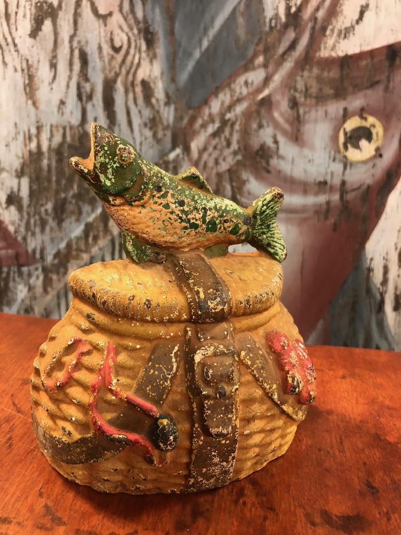 Cast Iron Door Stop: Fishing creel cast iron door stop, unusual with old paint.