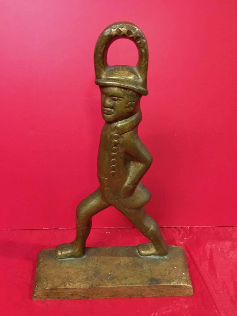 Brass Door Stop: Brass Door Stop in the shape of a gentleman.