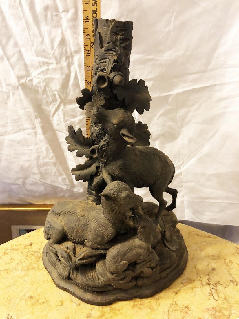 Black Forrest Carve Statue: Beautiful Black Forrest carved centerpiece. Unelievable carving featuring lamb, bunny, goat, acorns, oak leaves, etc. Measures approx. 16" tall.