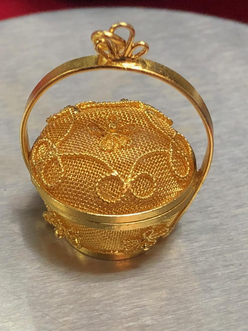 Gold Basket Charm: Gold Basket Charm, high karat, possibly 22kt, is hall marked. Beautiful, top screws off, weighs 1.4 dwts.