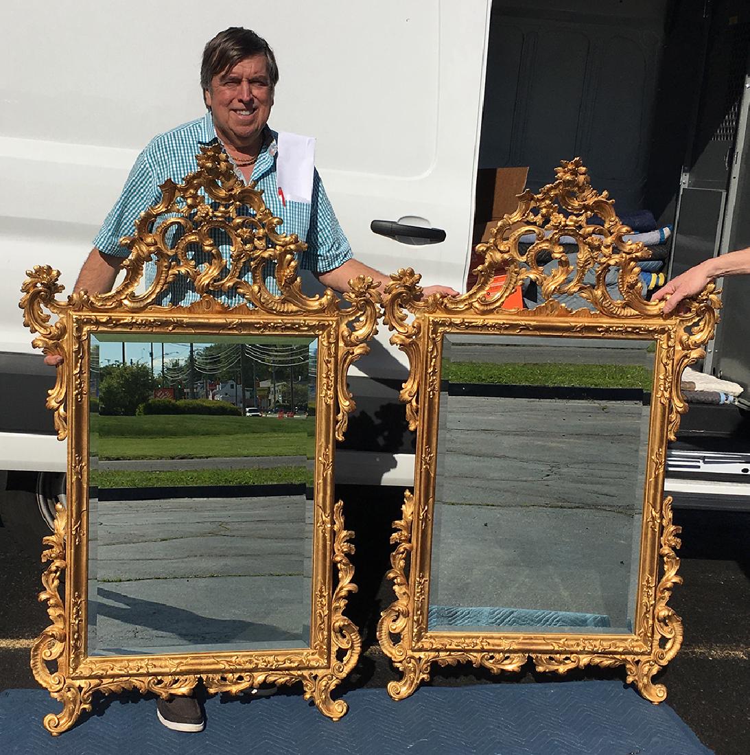 Pair of Matching Italian Gold Gilt MIrrors: Pair of beautifully ornate Italian gold gilt mirrors. Made is Italy, measures approx. 57â€ tall x 36â€ wide. Highly decorative, will make a fabulous compliment to the Demilune tables! Came from