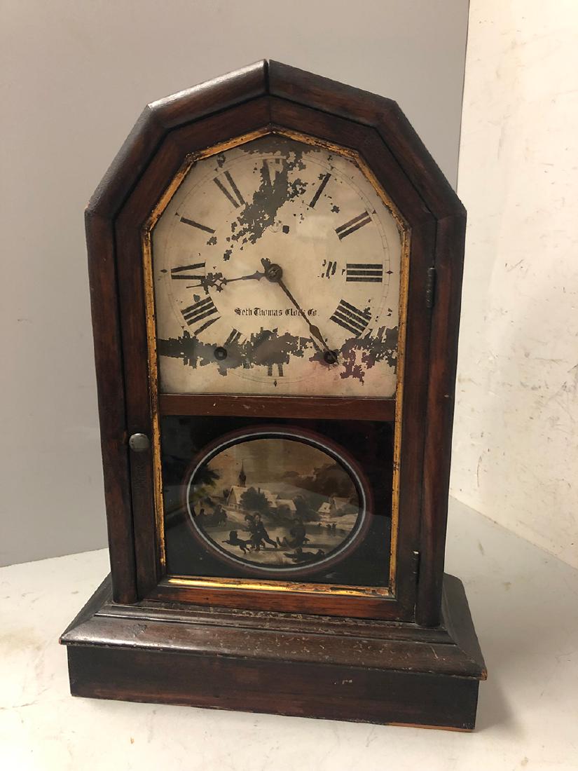 Seth Thomas Mantel Clocks: Seth Thomas Clock Co. Mantel Clock, all original with scene of children playing in the snow on lower glass, pendulum and key. From the Chatham, Mass., Cape Cod Collection.