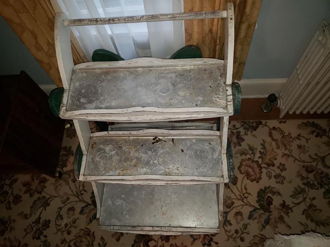 Estate Lot: Estate lot includes hand made folding tables, decorative wall fan, vintage metal cabinet, sewing cabinet, quilting materials, scrap books, coffee table, pressed back chair, vintage plant stand with or