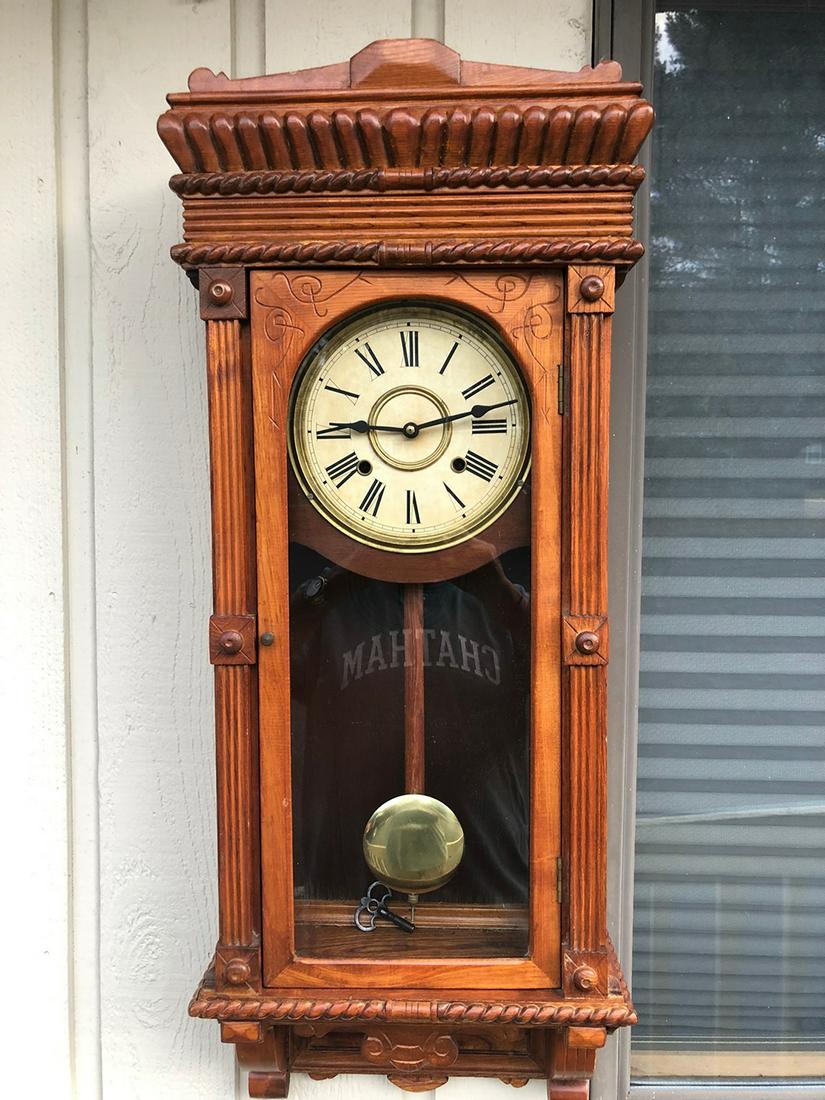 Regulator Clock: Oak key wind wall regulator clock, decorative, carved case, key and pendulum, in running condition.From Litchfield, CT Estate
