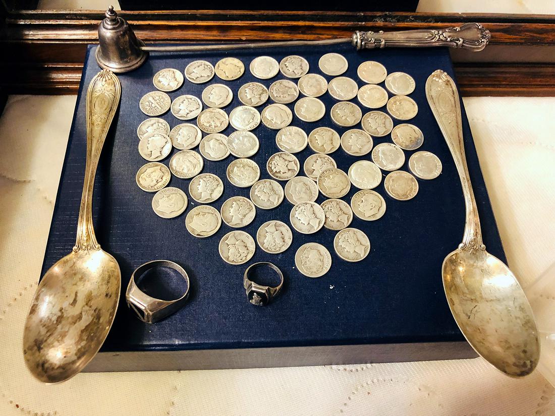 Silver Lot: Mercury, Roosevelt and Eisenhower dimes, 2 sterling silver spoons, 2 sterling menâ€™s rings, sterling candle snuffer.