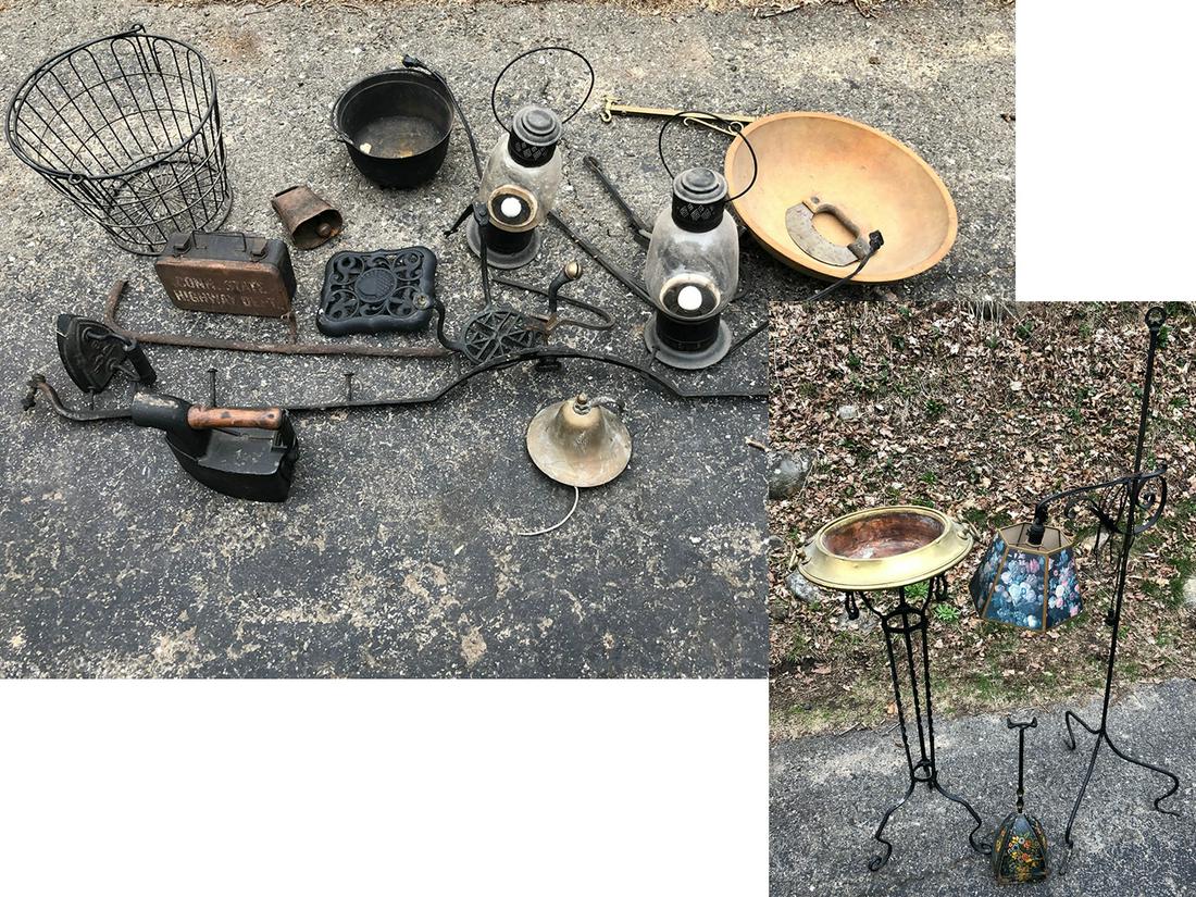 Primitive Estate Collectibles: Primitive estate collectibles include wire basket, sad irons, cow bells, lanterns, cast iron pot, wooden bowl, wrought iron pieces including floor lamp.