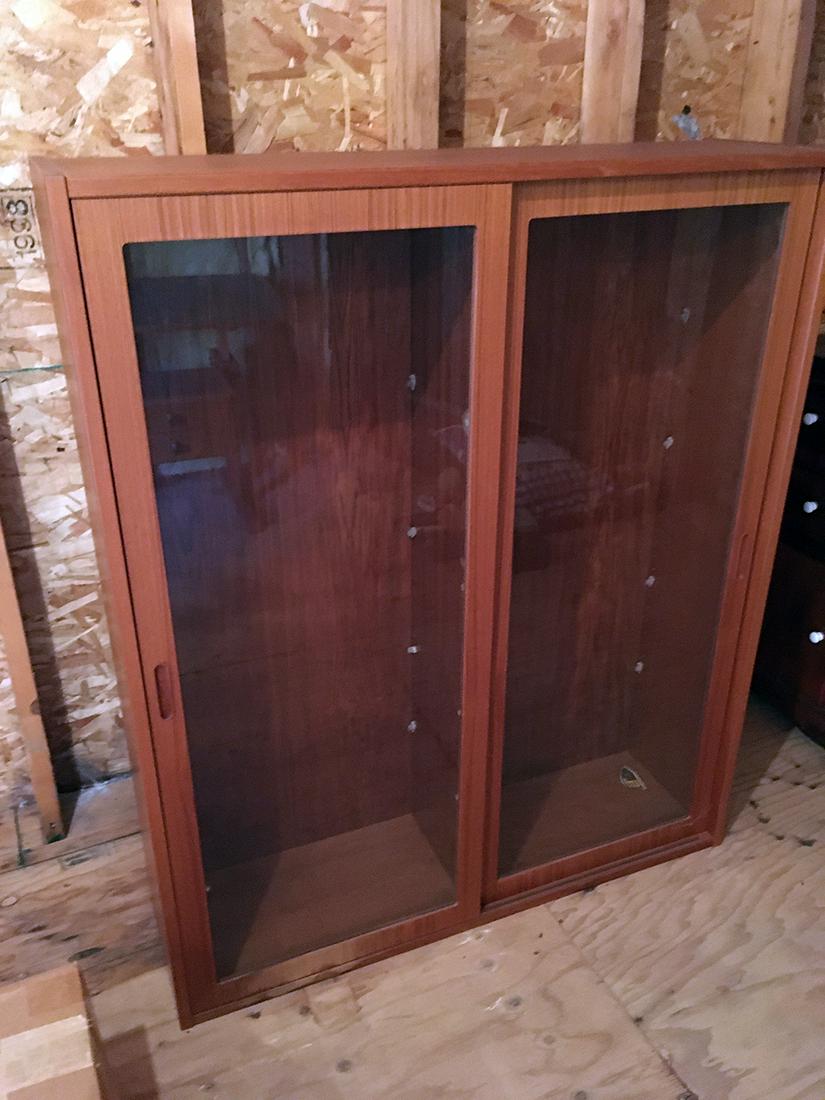 Mid-Century Danish, Hundevad, Cabinet / Hutch Top: Mid-Century Danish Modern glass door teak wood cabinet, Hundevand, Denmark. 2 glass doors, 8 glass shelves. Cabinet can be used as bookcase and also Hutch top for Lot 170A . Measures approx. 50.75 inc