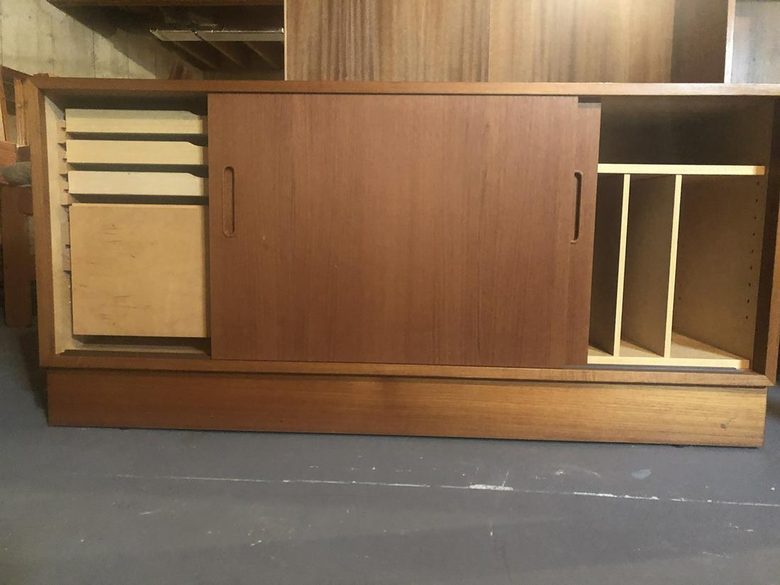 Hu Mid-Century Danish Desk Base: Hundevad Mid-Centry Danish desk base with sliding doors, flat and filing drawers, measures approx. 54.5 inches wide x 26.5 inches tall. Can be used with Lot 171B for complete desk unit.