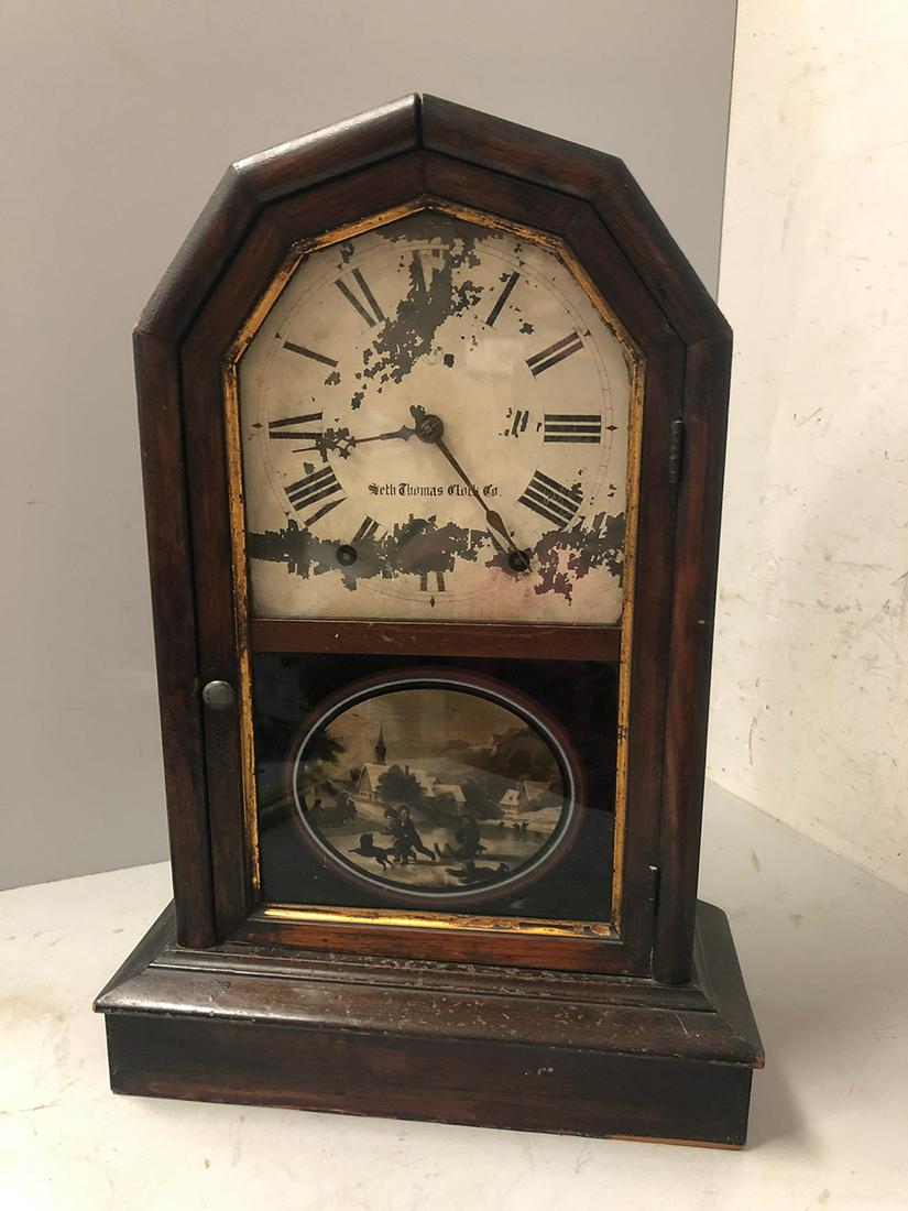 Seth Thomas Mantel Clocks: Seth Thomas Clock Co. Mantel Clock, all original with scene of children playing in the snow on lower glass, pendulum and key. From the Chatham, Mass., Cape Cod Collection.