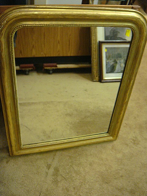 Estate Antique Gold Gilt Framed Mirror: From the Estate, Antique gold gilt framed mirror, with incising and flowers around the edge, plus beaded edge, all original, nice wood back. Measures 33 1/2 inches tall x 27 1/2 inches wide. This mirr