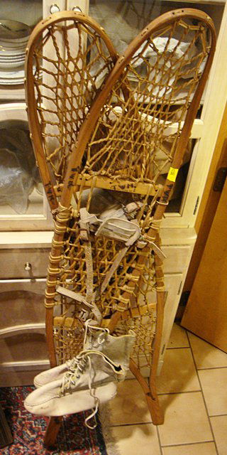 Antique Large Pr. Snow Shoes w/Boots: Large pair of snow shoes with original leather snow boots that go with them. Measure approx. 57 inches tall. Would make an excellent decorative addition to Adirondack or Cabin decor.