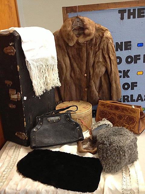Lady's Vintage Furs and Fashion Estate Lot: Lady's Vintage Furs and Fashion Estate Lot. Estate lot includes fur coat, fur hats (one marked G. Fox and Company) vintage hat box, black pelt, faux fur hat and gloves, linen table cloth and table run