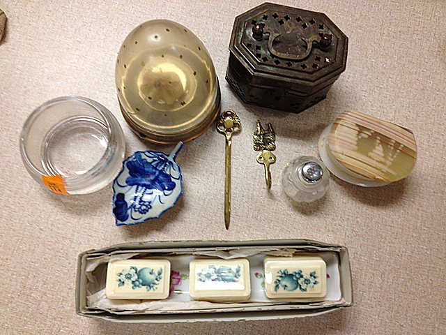 Estate Lot: Estate Lot including porcelian decorative soap dish, decorative brass holder, small stone box, vintage music box, flow blue spoon rest, salt shaker, brass hook and brass letter holder.