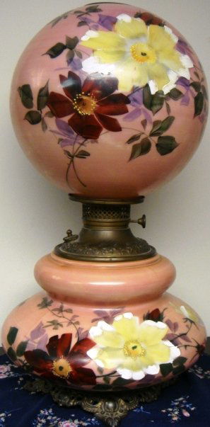 Victorian Pink "Gone with the Wind" Lamp with Flowers: Victorian Pink with Flowers "Gone with the Wind" lamp electrified 23 in. tall a nice shape and color. All original has been electrified in working order color pink background with round painted flower