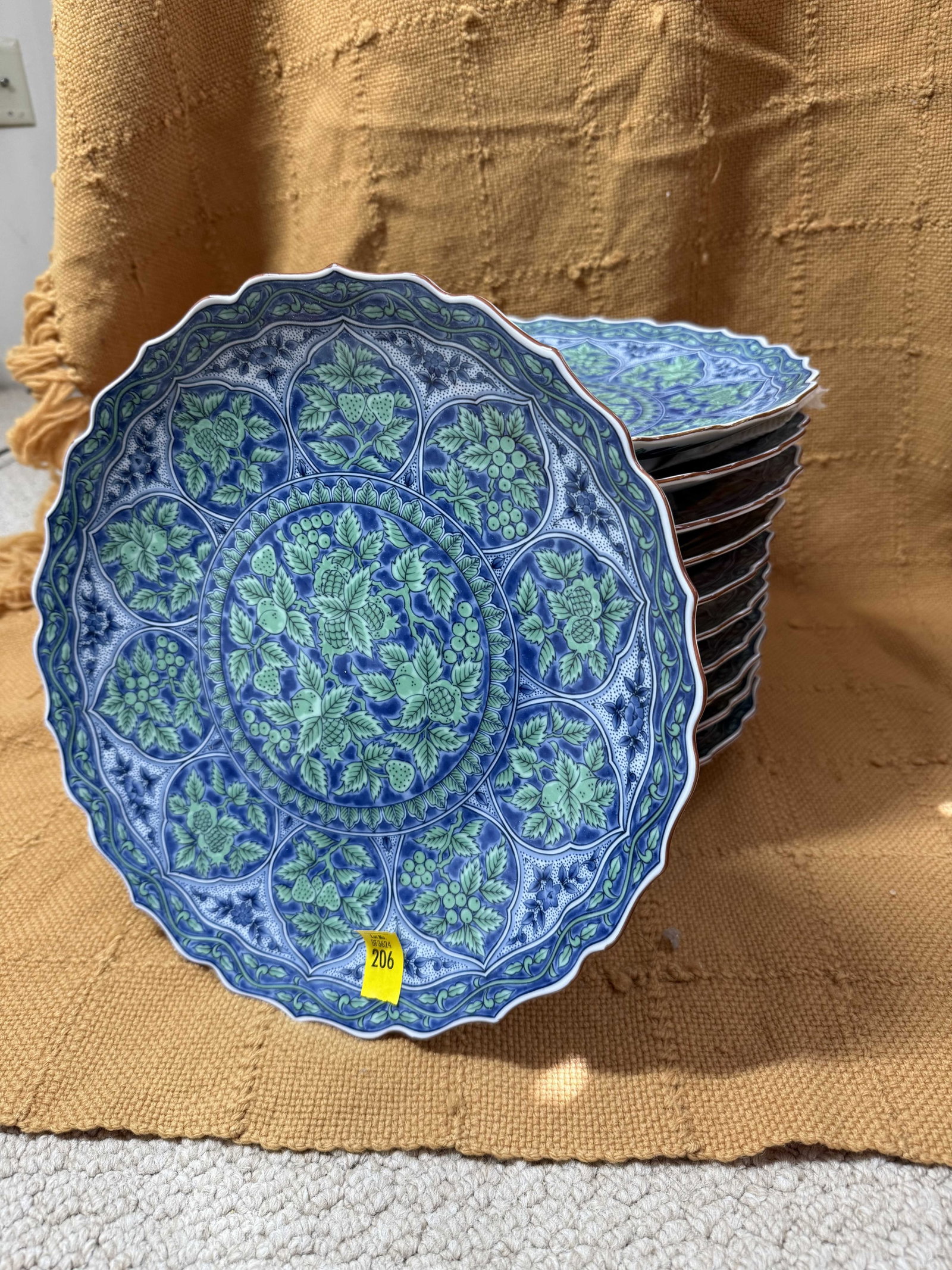Eleven Maebata Blue And Green Foliate Dinner Plates: Eleven Maebata Blue And Green Foliate Dinner Plates, Japanese, 20th C., each with ornate decoration, marks to base, wear consistent with age and use.