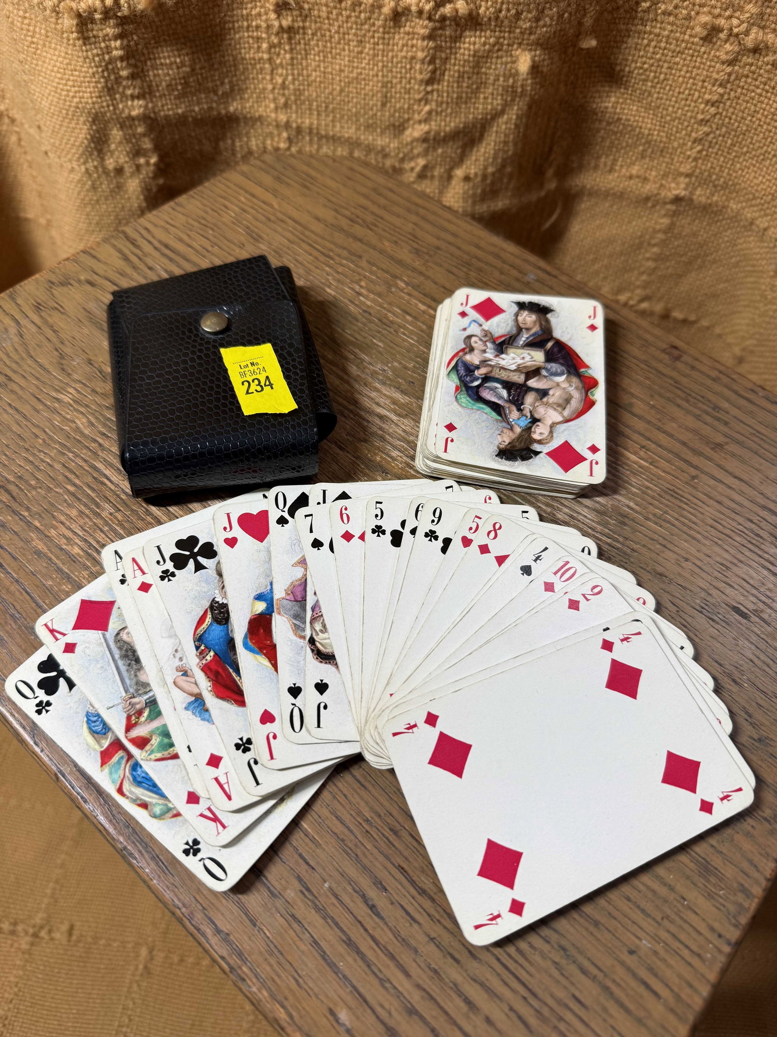 20th C. Pinup Cards: 20th C. Pinup Cards, with erotic illustrations to face cards and aces, housed in pouch, wear consistent with age and use.