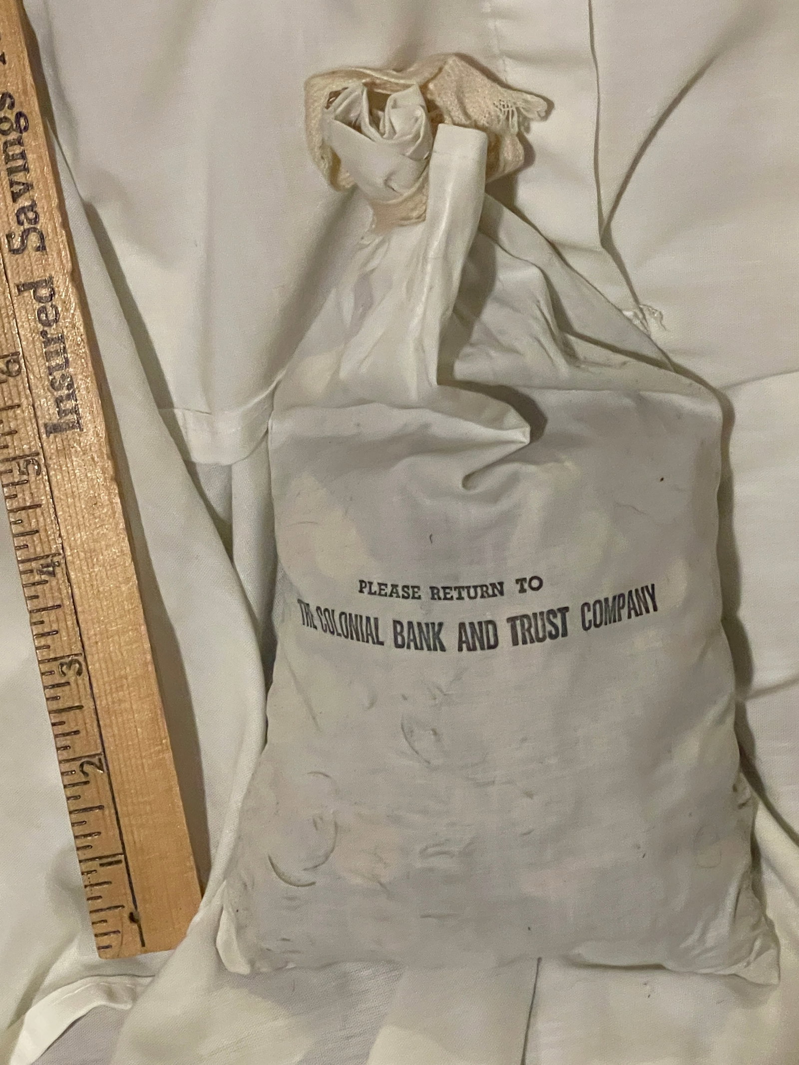 Colonial Bank and Trust bag of coins: description