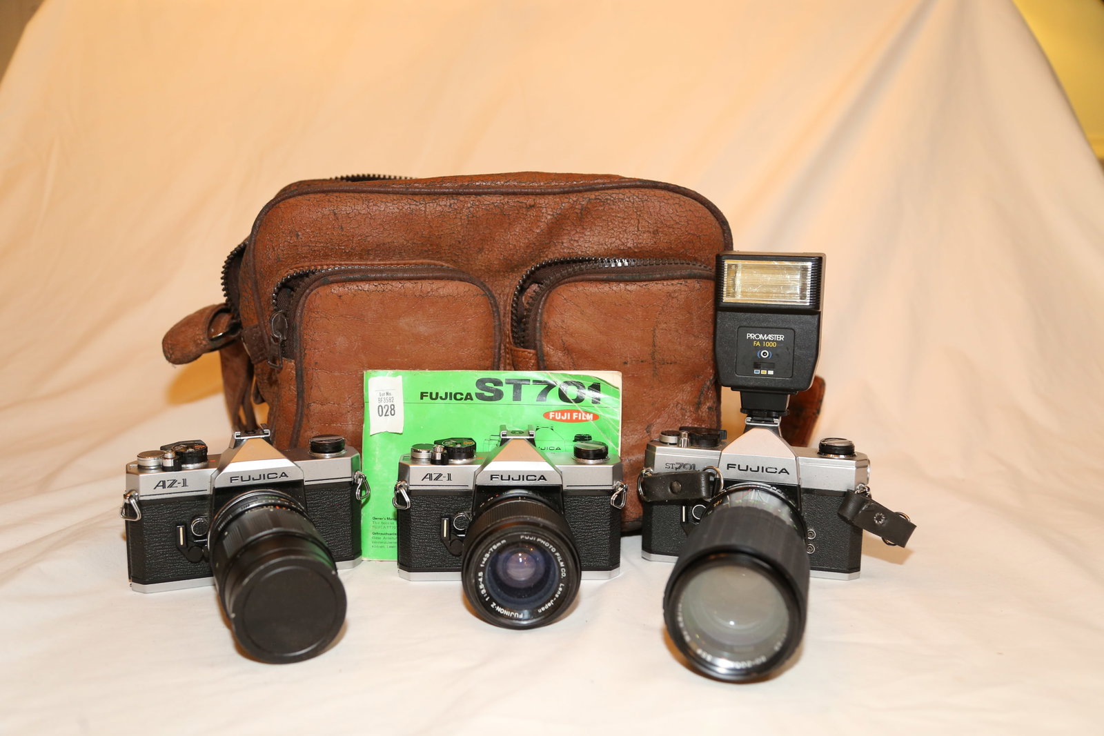 2 AZ-1 Fujica bodies: 2 AZ-1 Fujica bodies / 1 ST701 Fujica body, Promaster FA1000 flash, directions w/ carry bag, Fujinon-Z 1:3.5-4.5 f/43-75mm, Kalimar 80-200mm 3.9 zoom, Aetna Auto Coligon 1:3.5 f/135.