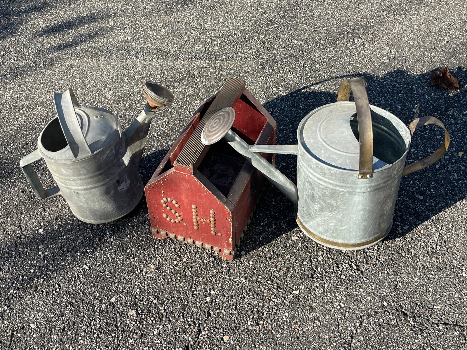 Antique Watering cans and tool box: description