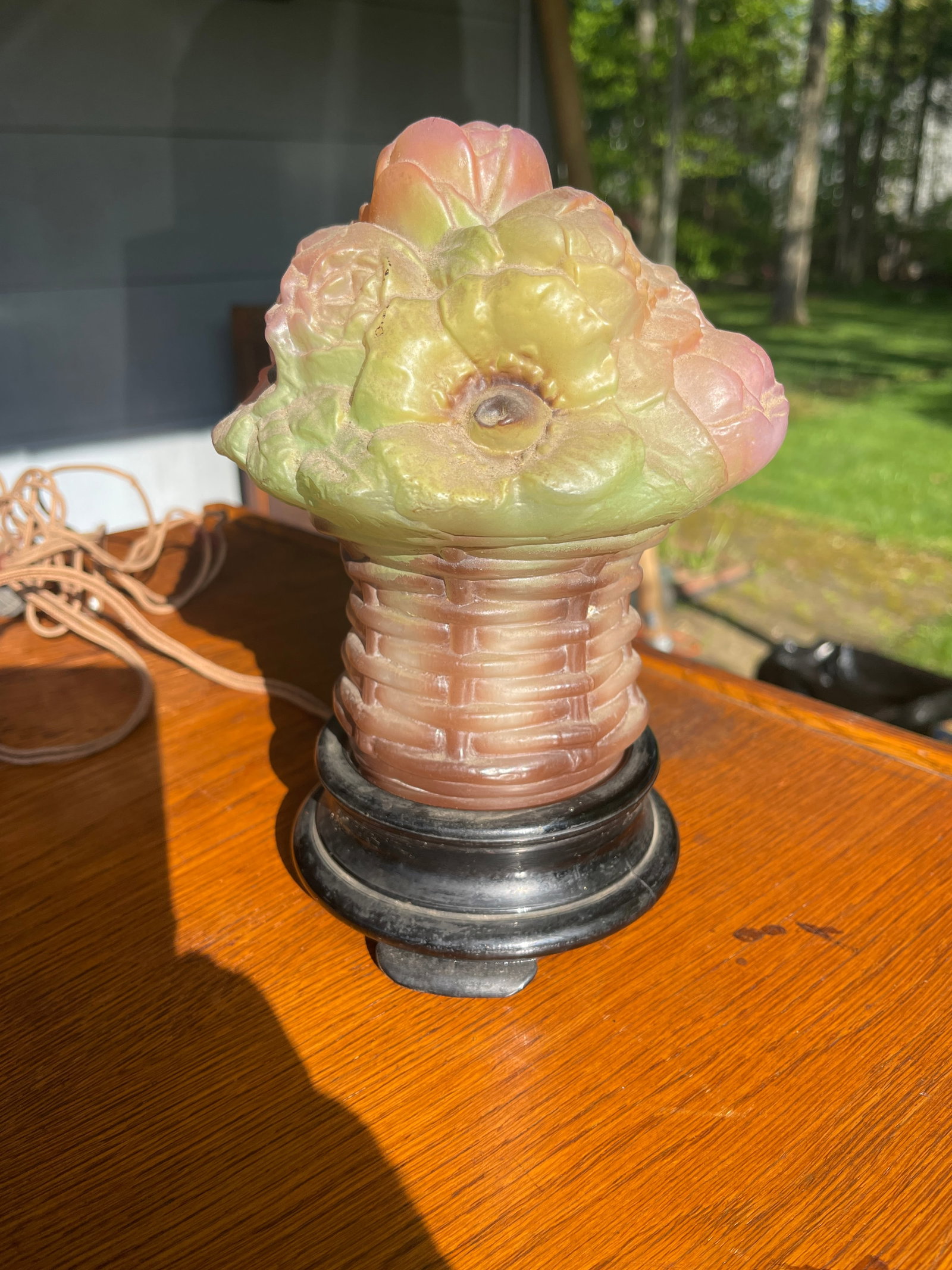 Decorative Glass Lamp: This is a decorative glass lamp that is a basket of fruit on a glass base.