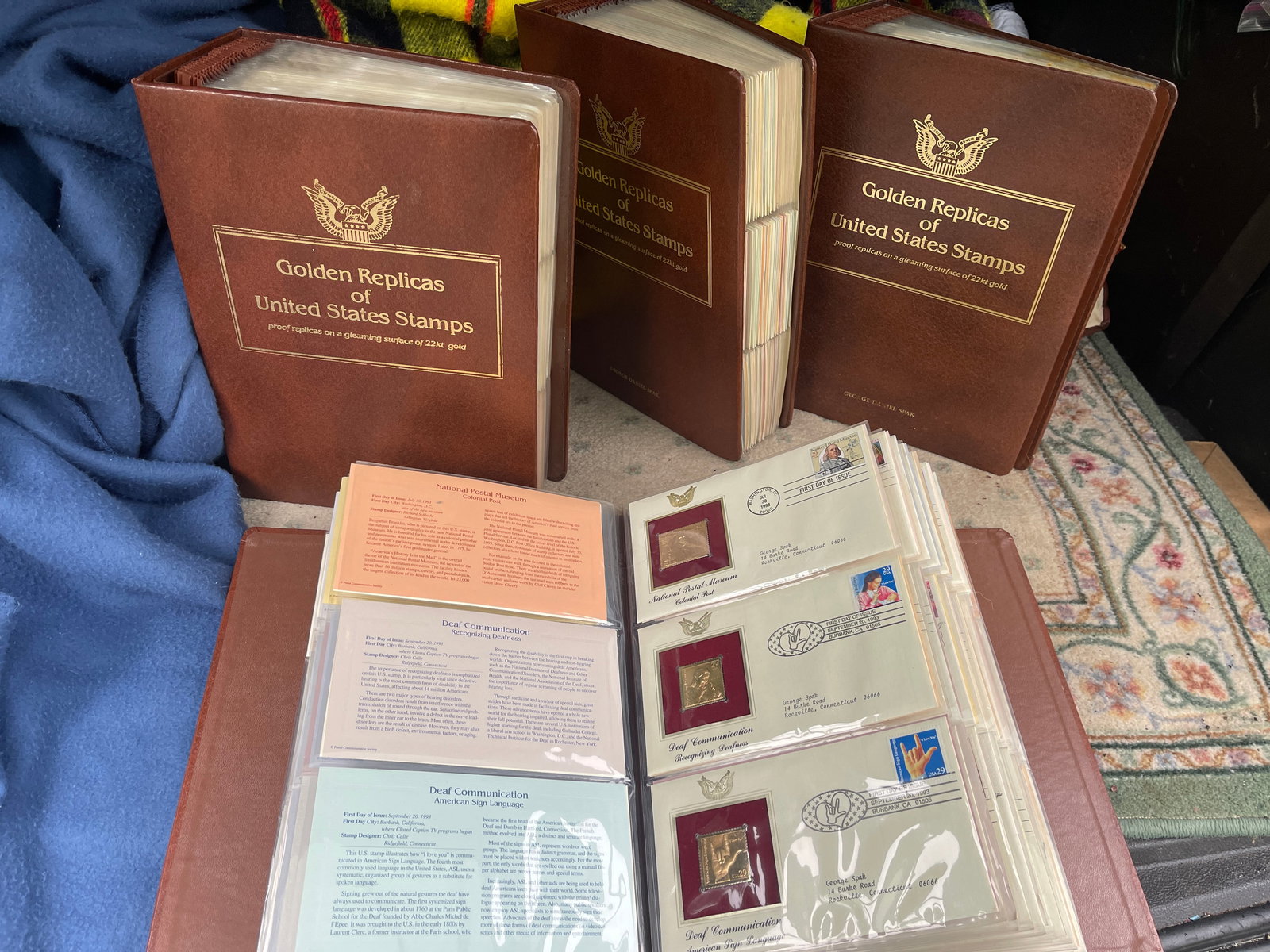 Golden Replicas of United States Stamps: This lot contains 3 binders of golden replicas of United States Stamps. These are proof replicas on a surface of 22 kt gold