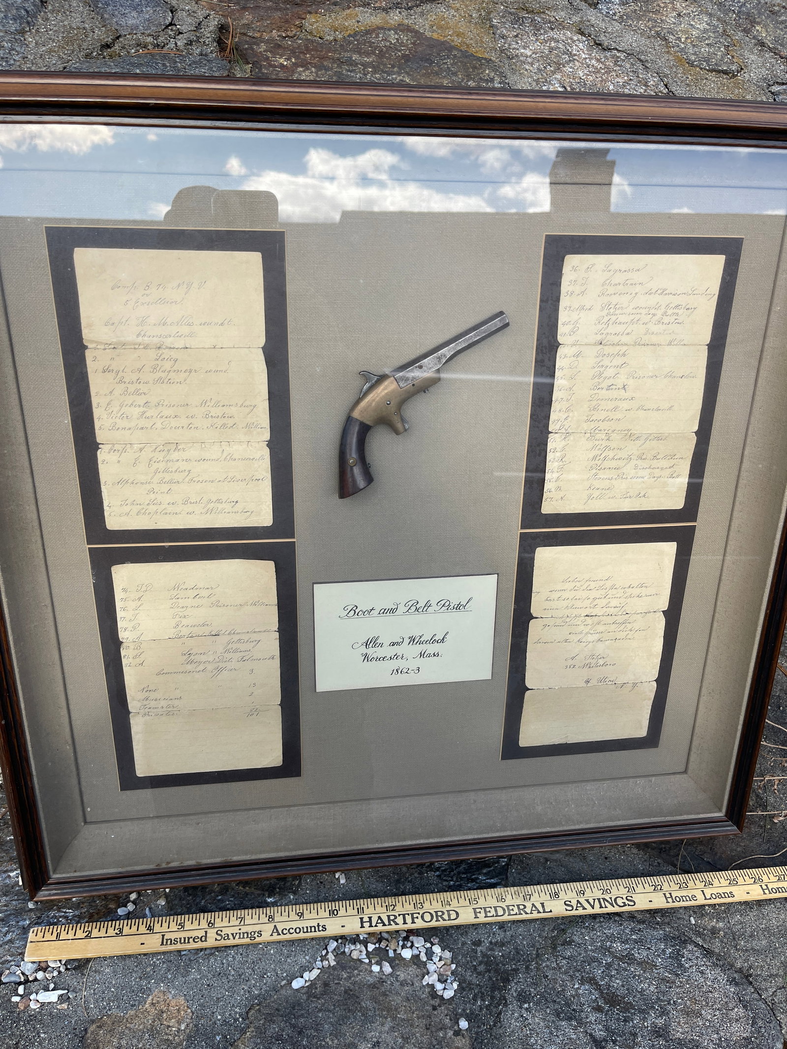 Allen and Wheelock Boot and Belt Pistol in shadowbox: This is a civil war era boot and belt pistol frames in a shadowbox alongside letters from members of the original owners families.