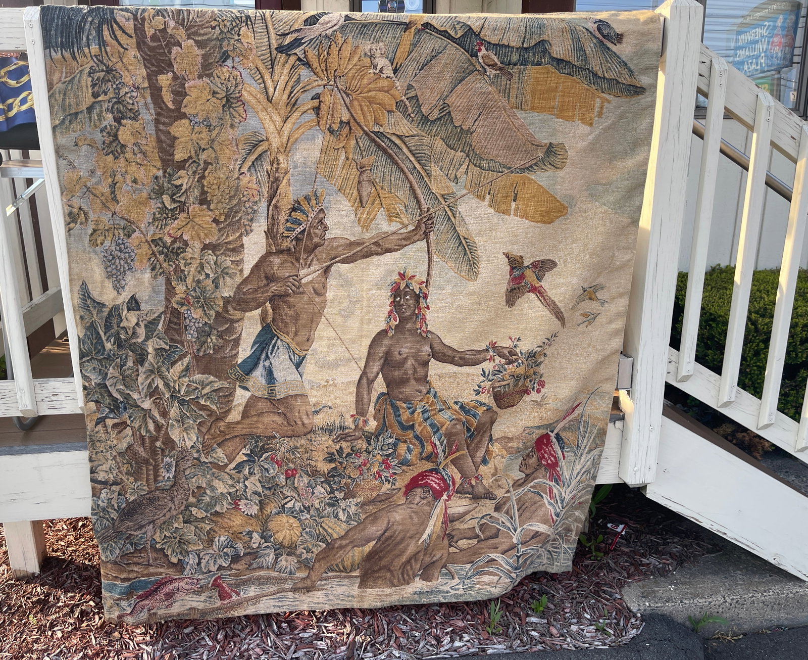 Vintage Decorative Tapestry featuring Indigenous People: This is a large decorative tapestry that that features Indigenous people and colorful plantlife.