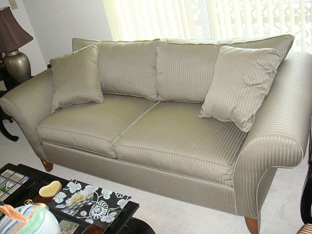 Ethan Allen Sofa: Ethan Allen Sofa, like new condition, 2 matching throw pillows, rolled out arms, olive green color, "The Dudley" from Ethan Allen. Owner was a non-smoker in non-smoking home. Originally purchased new