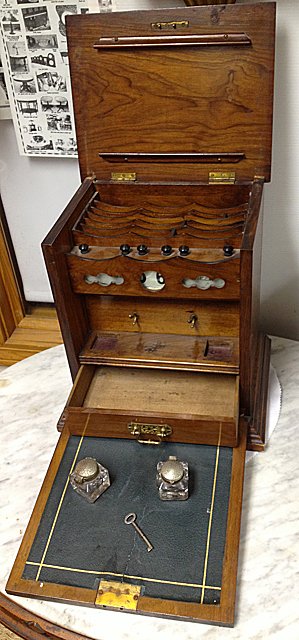 Traveling Antique Secretary's Desk: Traveling Antique Secretary’s Desk with Original Ink and Calendar. Dated November 10, 1888. A very unique piece, folds out to reveal writing blotter, calender, quill pen holder, file folder / paper 