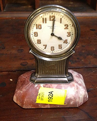 Tiffany and Co. 8 Day Desk Clock, Sterling Silver Case: Tiffany and Company 8 Day Desk Clock with sterling silver case on pink marble base, has slight age line in dial, otherwise unusual desk clock. -CT