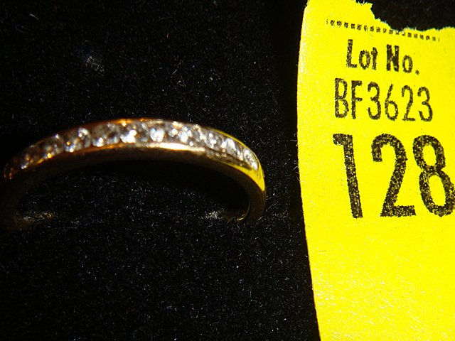 Estate 18kt gold Tiffany & Co. Ladies Ring with: Estate 18kt gold Tiffany & Co. Ladies Ring with Diamonds. Has 11 diamonds in channel setting. Ring is in excellent condition. -CT