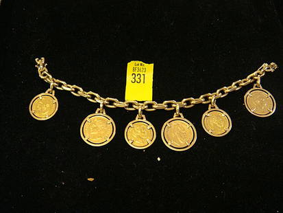 Estate Gold Coin Charm Bracelet: Estate Gold Coin Charm Bracelet marked 585 which is 14kt gold, Cold German Marks are coins. Important: has 6 gold coins encased in 14kt gold holders, which was made to encase the coins without hurting