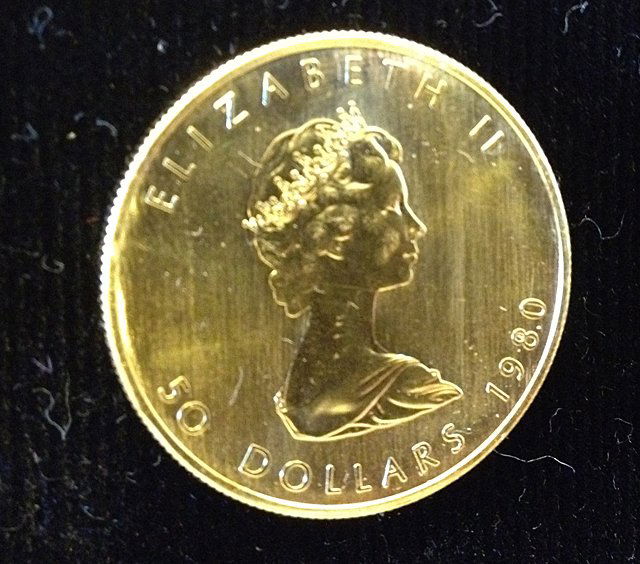 1 Oz. 1980 Maple Leaf Gold Coin: 1 Oz. 1980 Maple Leaf Gold Coin; Weight 31.1033 (1 troy oz.), Fineness; .999 or 24 karats, Diameter; 30 mm; Fine Gold Content; 31.1033 grams (1 troy oz.) Estimated value of $1,400 - $1,500