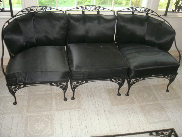 Estate 3 Piece Black Wrought Iron Sectional Sofa: Estate 3 piece black wrought iron sectional sofa with decorative acorn design and dark blue seat and seat back cushions. Sofa pulls apart to make 3 separate chairs. In nice, original condition, attrib
