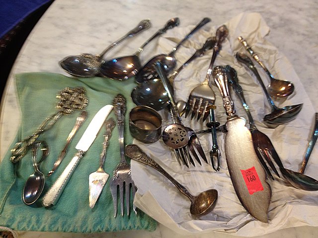 21 Estate Pieces of Silver Plate: 21 estate pieces of silver plate. Flatware pieces, there is one sterling silver knife (handle is sterling silver onle), very ornate pieces In nice condition and well taken care of family heirlooms.